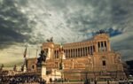 Stunning view of the Victor Emmanuel II Monument in Rome under dramatic skies.