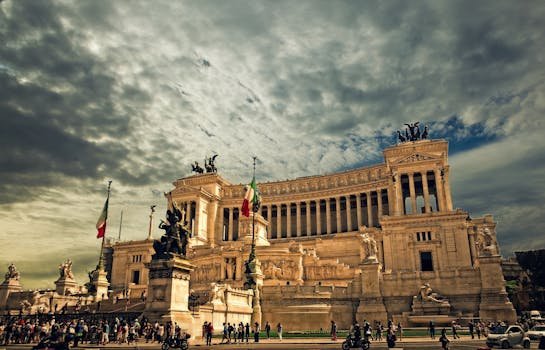 Stunning view of the Victor Emmanuel II Monument in Rome under dramatic skies.