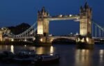 A stunning night view of London's Tower Bridge illuminated over the River Thames.