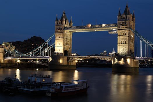 A stunning night view of London's Tower Bridge illuminated over the River Thames.