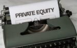 Close-up of vintage typewriter with 'PRIVATE EQUITY' on paper, business concept.