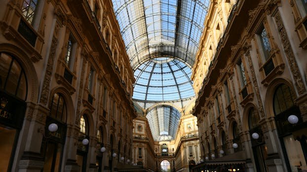 Explore the stunning architecture of Galleria Vittorio Emanuele II, Milan's iconic shopping gallery.