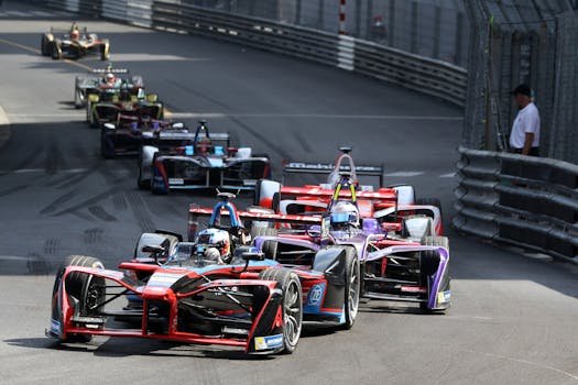 Thrilling Formula E cars racing through Monaco's iconic circuit, showcasing speed and competition.