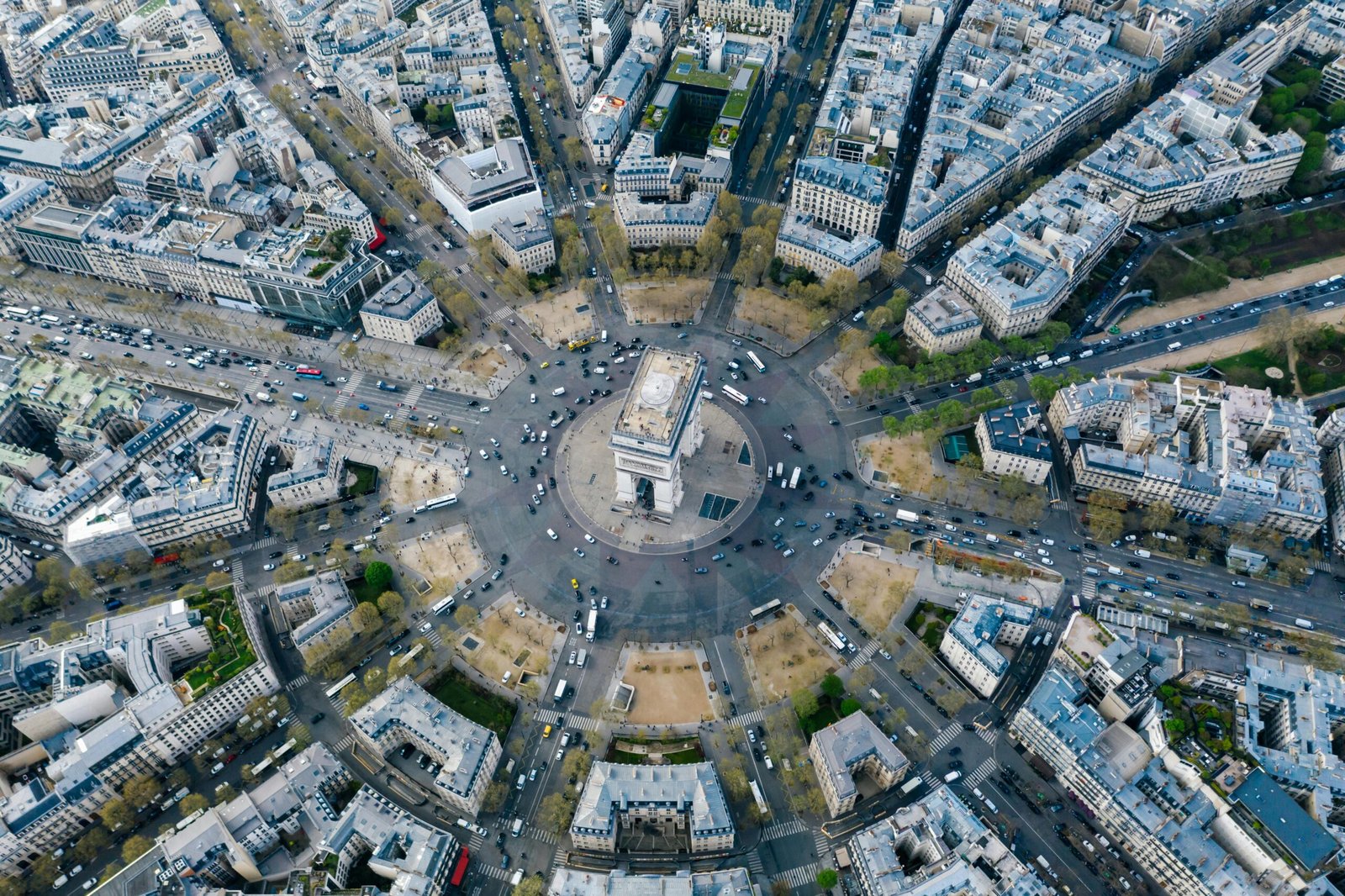 Breathtaking aerial image of Arc de Triomphe nestled within Paris's vibrant cityscape.