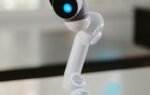 Close-up of a sleek humanoid robot showcasing advanced technology in a modern environment.