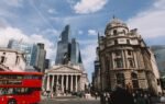 Vibrant street view of London's skyline featuring modern skyscrapers and historic architecture.