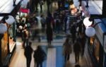 Blurred crowd in Budapest market hall, showcasing vibrant life.
